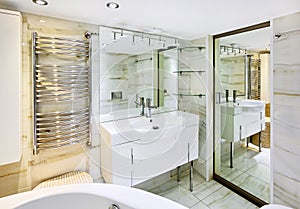 Wash stand with mirror in bathroom interior