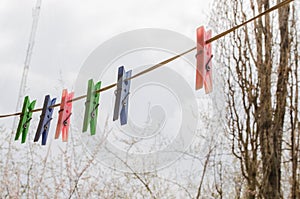 Wash things. clothesline. Clothes pegs. Drying things. Multi-colored clothespins.  cleaning company