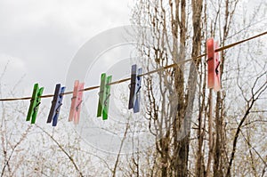 Wash things. clothesline. Clothes pegs. Drying things. Multi-colored clothespins.  cleaning company