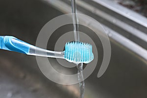 Wash Toothbrush after cleanliness with water sink personal hygi