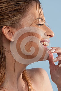 Wash your face and take care of your skin. Young woman washes her face.