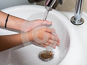 Wash your hands on the sink. Hand care. The reservoir of pathogens