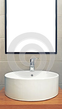 Washbasin in modern bathroom with mirror on the wall