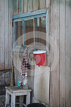 washbasin in the village, weighs on the wall of the house, next to soap and a towel