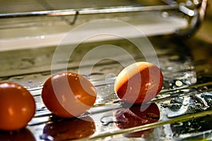 Washed clean eggs on sink drainer in kitchen