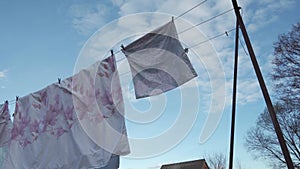 Washed, clean linen hangs on a clothesline