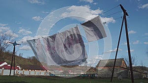 Washed, clean linen hangs on a clothesline