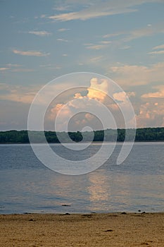 Washed Drift wood litters the beach on the Penobscot river in Ma