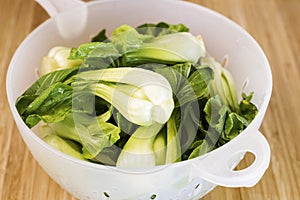 Washed oriental Vegetable in Drain Bowl