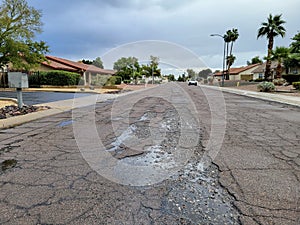 Washed Out Asphalt Pavement of Residential Road in Phoenix, AZ