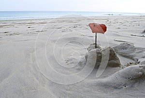 Washed Out Sand Castle by Kid - Sand Play at White Sandy Beach with Sea in Background - Leisure, Fun, Play and Activity