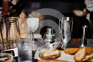 Washed professional bar equipment on the bar counter