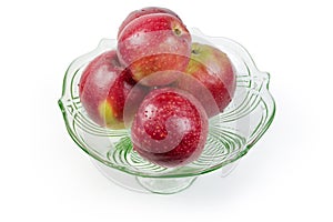 Washed red apples in the vintage glass vase for fruits