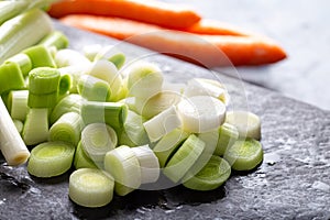 Washed sliced leek. sliced leek on stone cutting board