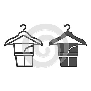 Washed trousers on clothes hanger line and solid icon, dry cleaning concept, pants on hanger vector sign on white