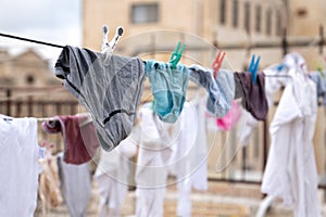 Washed underwear is dried on a rope outdoors