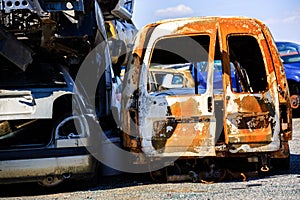 Washed up, abandoned cars in a car dump