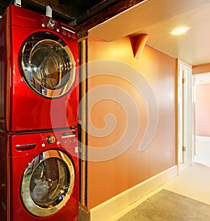 Washer and dryer in red in the basement