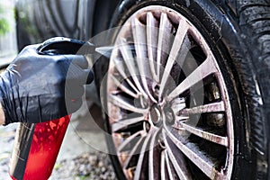 Washing the car. Cleaning aluminum wheels. Car wash