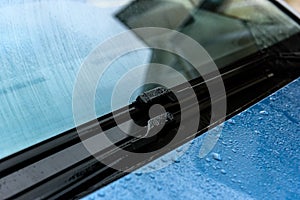 Washing car windscreen with wipers and liquid