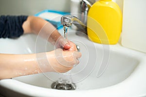 Washing of child hands with soap  for corona virus prevention