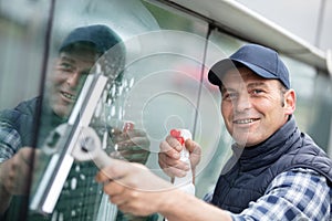 Washing and cleaning window with squeegee