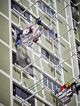 Washing day in a Singapore high-rise building, out on poles photo
