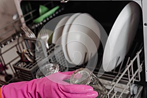 Washing dishes in dishwasher