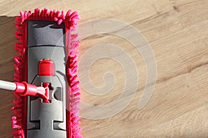 Washing Dust on Wooden Floor with Mop