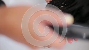 Washing girl's hair in a hairdressing salon close up