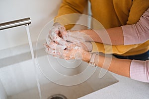 Washing hands with alcohol gel or antibacterial soap sanitizer. Hygiene concept