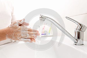 Washing hands in the bathroom