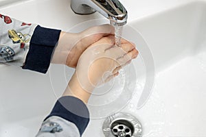 Washing hands. Hygiene and cleanliness. Bathroom background