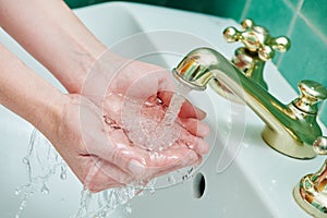 Washing hands. hygiene and dysentery prevention. faucet tap with flowing water