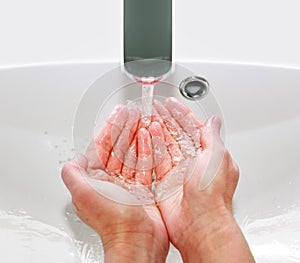 Washing hands in sink