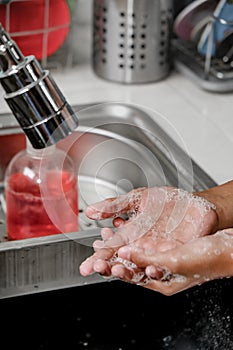Washing Hands with Soap Bubbles Closeup Shot