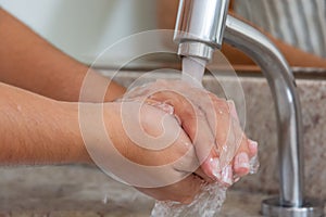 Washing hands with soap for hygiene and health care to prevent corona virus 13