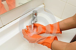 Washing Hands with streaming water in bathroom