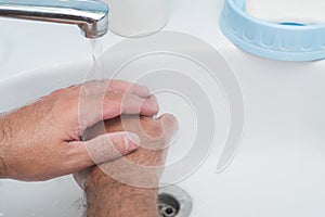 Washing hands under water