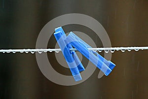 Washing line and blue pegs