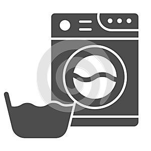 Washing machine and basin solid icon. Laundry room vector illustration isolated on white. Washer and basket glyph style