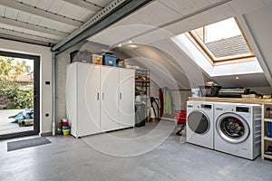 Washing machine with cabinet in attic garage
