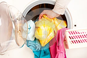 Washing machine with colorful clothes photo