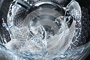 Washing machine drum with water, closeup view