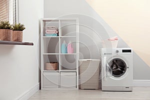 Washing machine in laundry room interior