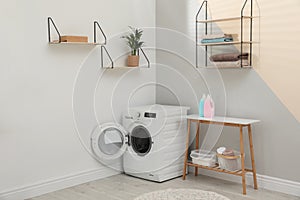 Washing machine in laundry room interior