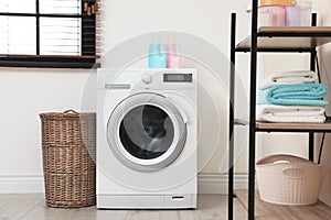 Washing machine in laundry room interior