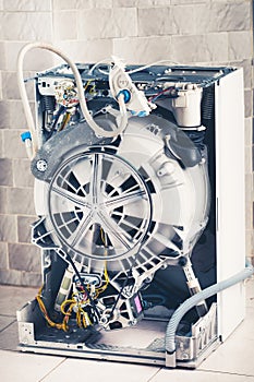 Washing machine with open enclosure is ready for service