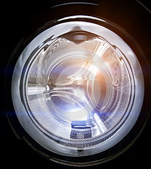 Washing machine. A open loading hatch close up