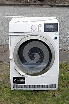 Washing machine outside on a rainy day